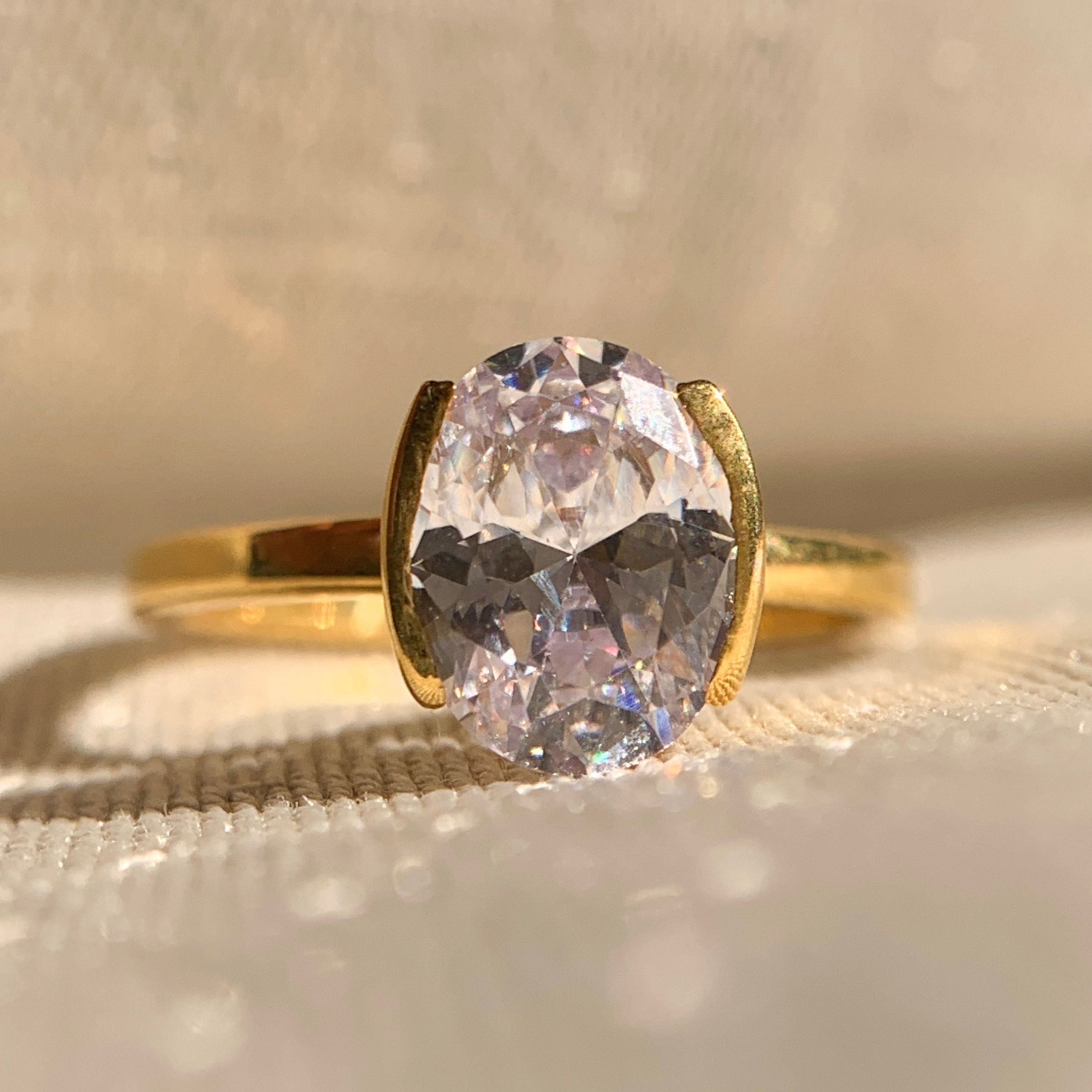 Oval Cut Diamond Half Bezel Set Ring